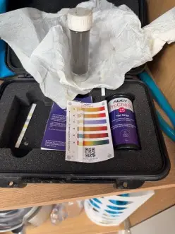 ADEY ProCheck water quality test showing contaminated heating system water in Hanwell W7.